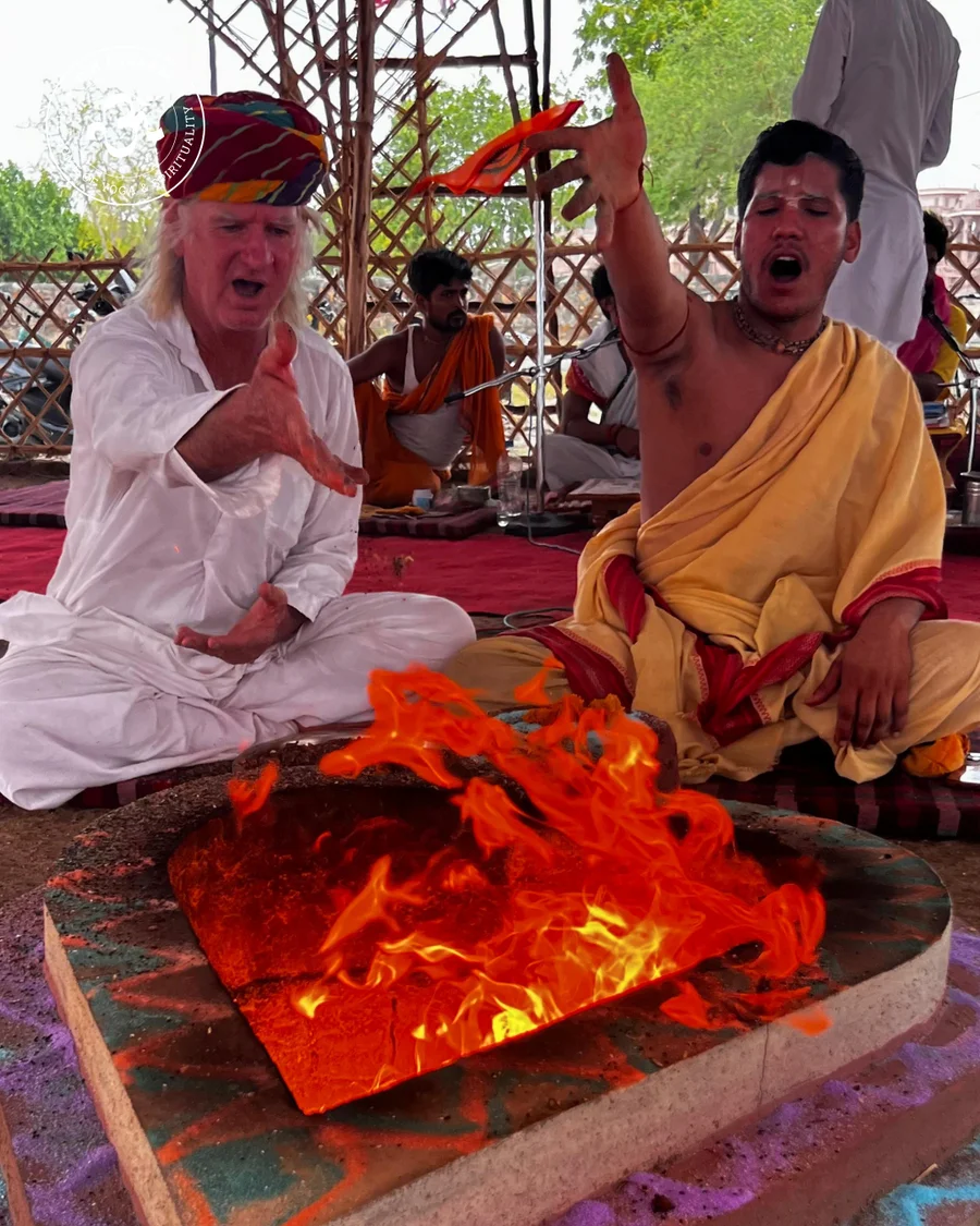 Men shouting SVAHA during the fire ritual.